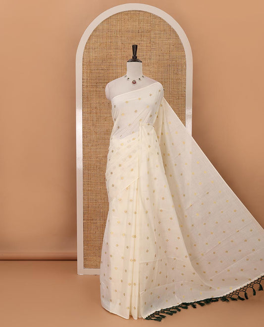 Borderless Kerala cream all over zari buttas saree, zari design pallu with green tussels & zari buttas blouse