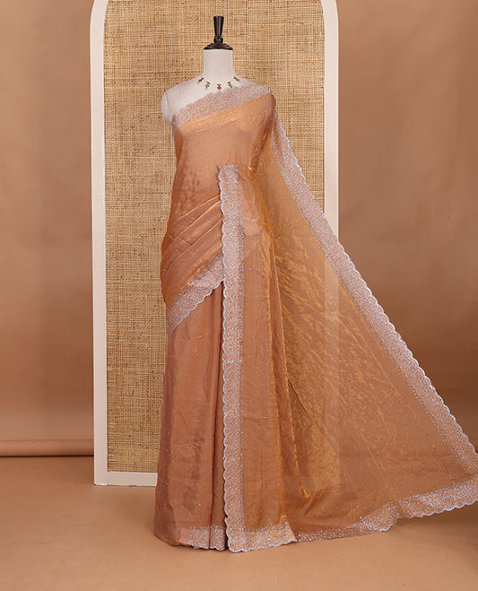 Peach Swarovski crystal stone embedded fendy chiffon saree, scallop Swarovski stone embroidered border, and contrast plain blouse