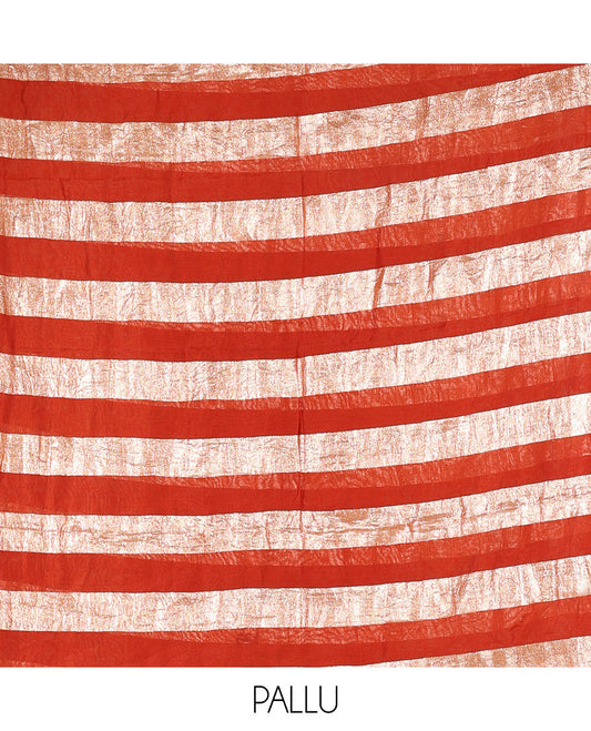 Rust material chudidar set, plain with pom-pom tasseled mul chanderi top, a matching bottom, and organza dupatta of stripes