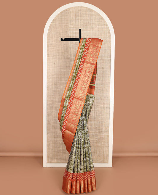 Olive green intricately designed semi-banaras patola silk saree, contrast floral creeper zari design border, and pallu of chevron and floral designs