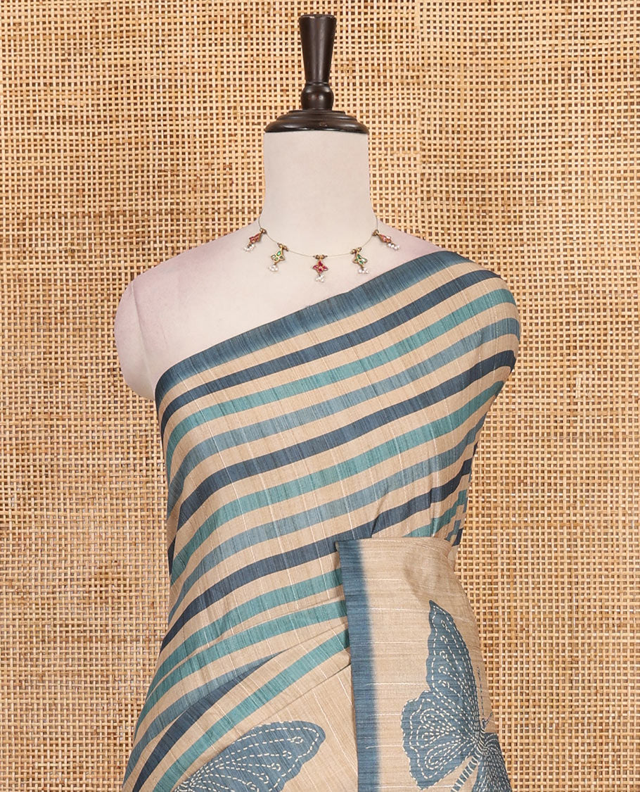 Blue horizontal stripes printed soft tussar saree adorned with big butterfly motifs printed border and pallu, contrast blouse