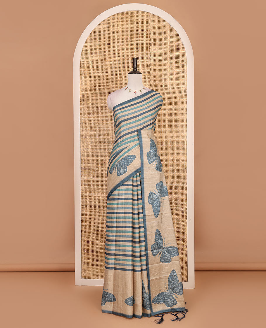 Blue horizontal stripes printed soft tussar saree adorned with big butterfly motifs printed border and pallu, contrast blouse