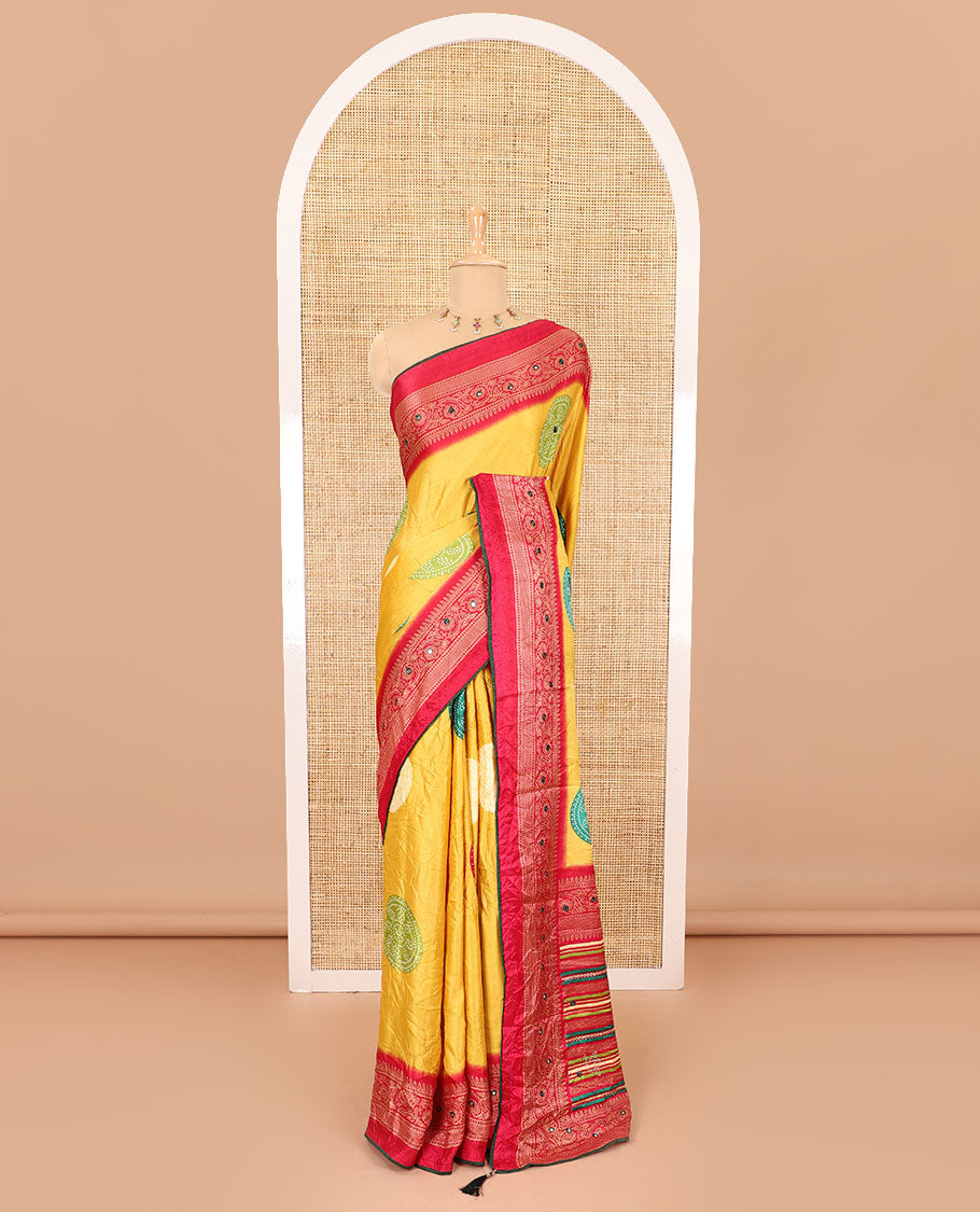 Yellow bandhani printed with mirror work moss crepe saree, contrast traditional design mirror work border, printed pallu of Swarovski stone work, and a contrast plain blouse