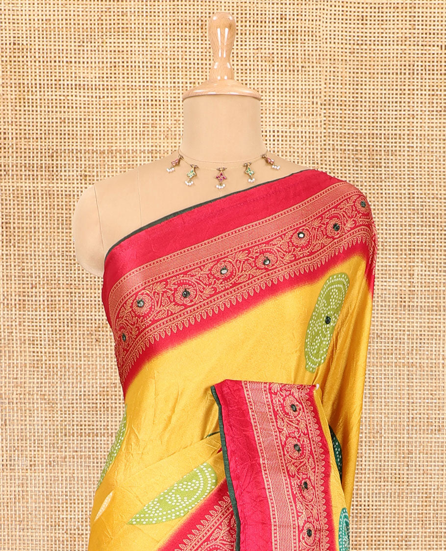 Yellow bandhani printed with mirror work moss crepe saree, contrast traditional design mirror work border, printed pallu of Swarovski stone work, and a contrast plain blouse