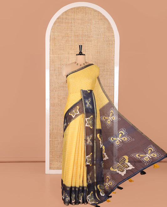 Yellow Linen Cotton Saree, Subtly Sparkled With Checked Design On Its Body, Complemented by Contrast Border Artfully Printed with Butterflies, Pallu Steeped with Butterflies, and Paired with a Contrast Blouse