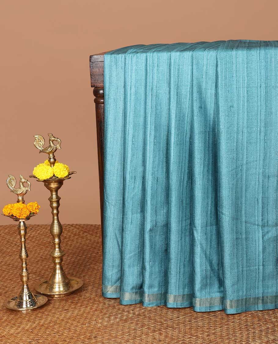 Blue semi kicha tussar saree with small zari border & kalamkari pallu along with floral printed blouse
