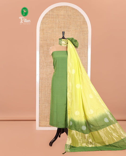 Green Semi Silk Material Churidar Set, Subtly Made Plain Top, a Plain Santoon Bottom, and Is Paired with a Dual-Colored Bandhani Motifs Semi Silk Dupatta