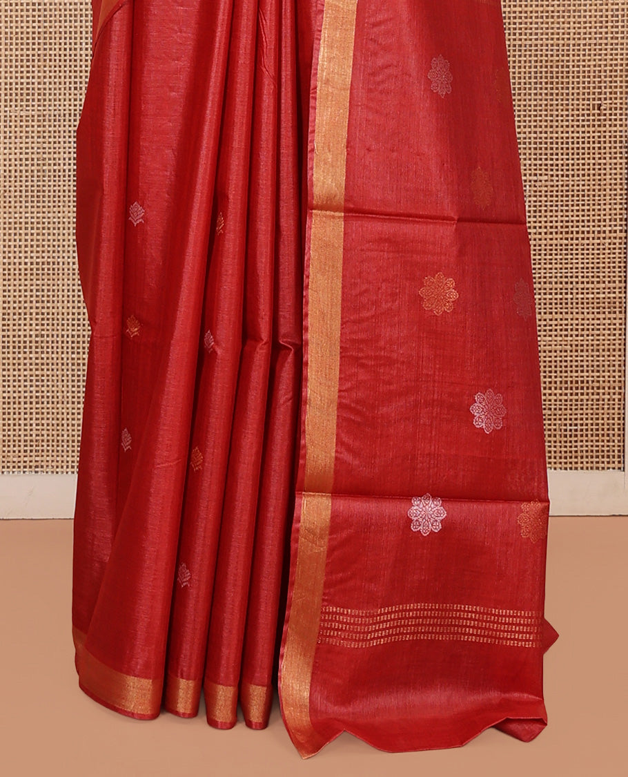 Red Tussar Saree, Beautified with Buttas, a Subtle Zari Border, Pallu of Intricate Designs, and a Matching Blouse