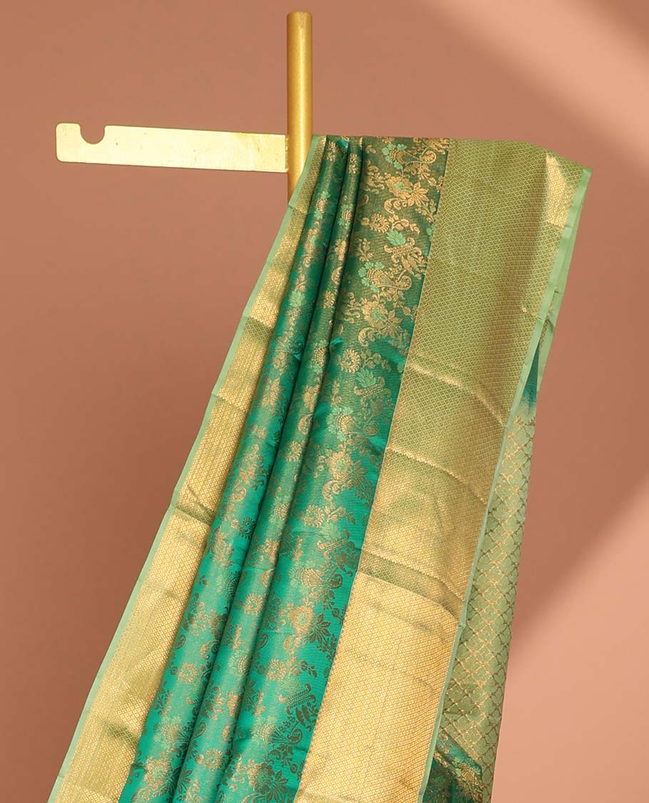 Green floral jacquard kancheepuram silk saree with contrast checked zari border & pallu of argyle pattern