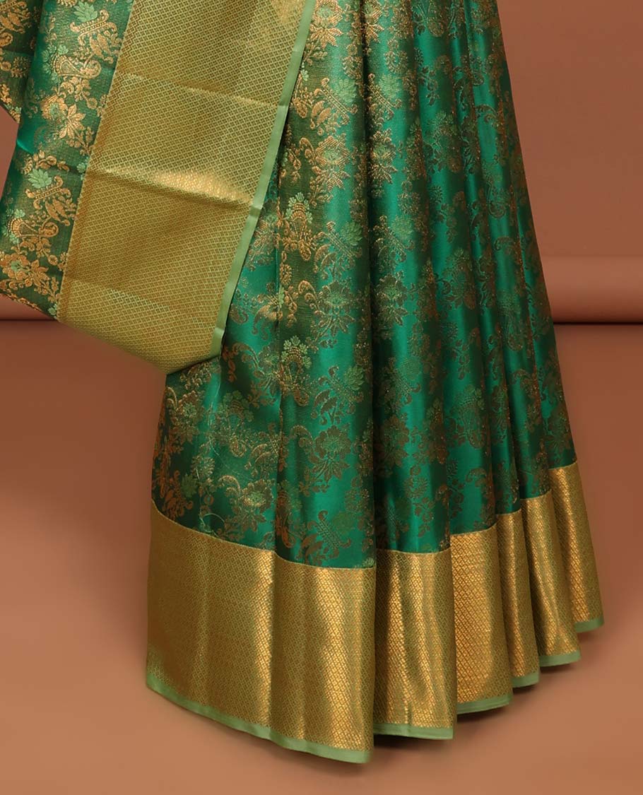 Green floral jacquard kancheepuram silk saree with contrast checked zari border & pallu of argyle pattern