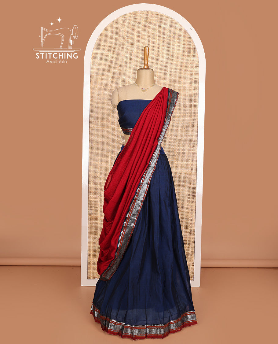 Navy blue cotton half-saree, plain with contrast geometric bordered skirt, matching blouse, and contrast geometric bordered dhavani