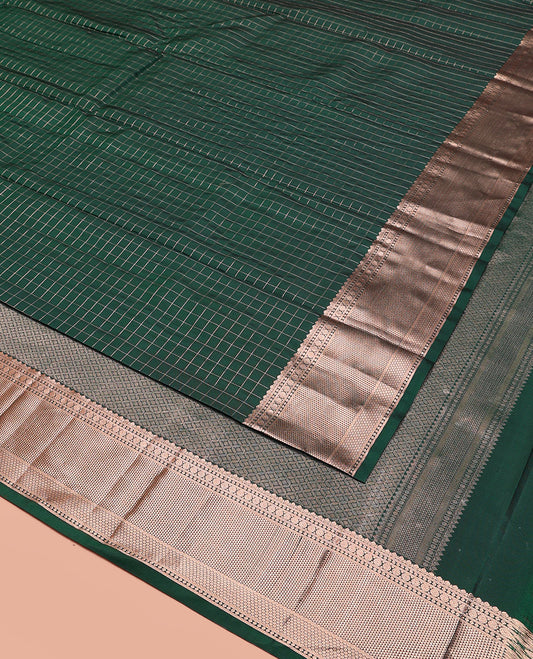 Green Vasundhara Silk Saree Beautifully Bedecked with Checks, Highlighted by a Zari Border of Rudraksham, Ara Maadam, and Mayil Kann Designs, Delicately Woven Geometric Patterned Pallu, and Paired with a Matching Blouse