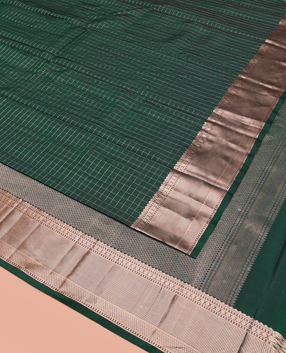 Green Vasundhara Silk Saree Beautifully Bedecked with Checks, Highlighted by a Zari Border of Rudraksham, Ara Maadam, and Mayil Kann Designs, Delicately Woven Geometric Patterned Pallu, and Paired with a Matching Blouse
