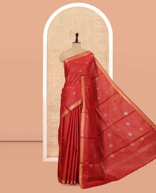 Red Tussar Saree, Beautified with Buttas, a Subtle Zari Border, Pallu of Intricate Designs, and a Matching Blouse