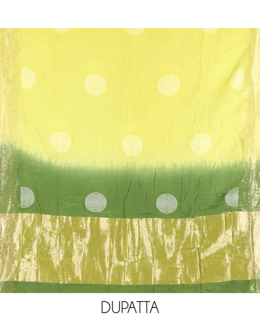 Green Semi Silk Material Churidar Set, Subtly Made Plain Top, a Plain Santoon Bottom, and Is Paired with a Dual-Colored Bandhani Motifs Semi Silk Dupatta