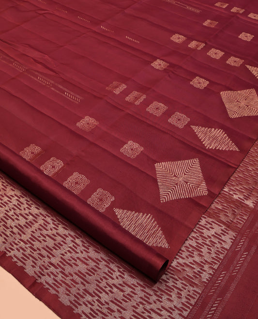 Borderless Maroon Mayuri Soft Silk Saree, Adorned with Buttas All Over Its Body, a Self-Pallu of Geometric Patterns, and Paired with a Matching Blouse