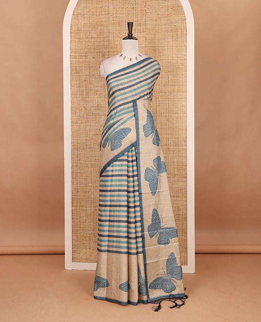 Blue horizontal stripes printed soft tussar saree adorned with big butterfly motifs printed border and pallu, contrast blouse