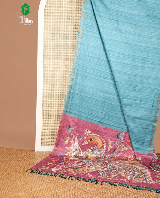 Blue semi kicha tussar saree with small zari border & kalamkari pallu along with floral printed blouse