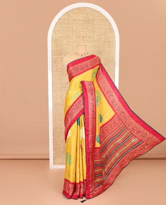 Yellow bandhani printed with mirror work moss crepe saree, contrast traditional design mirror work border, printed pallu of Swarovski stone work, and a contrast plain blouse