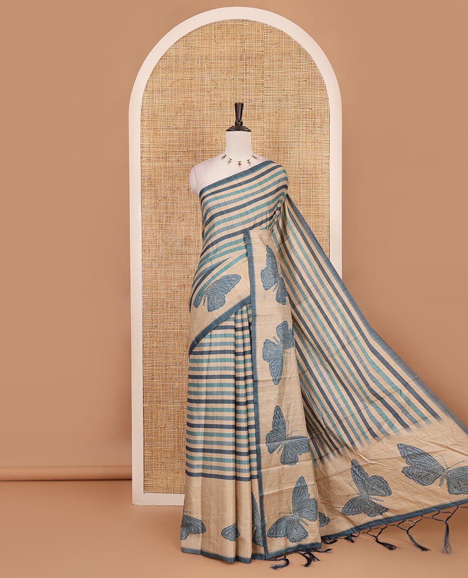 Blue horizontal stripes printed soft tussar saree adorned with big butterfly motifs printed border and pallu, contrast blouse