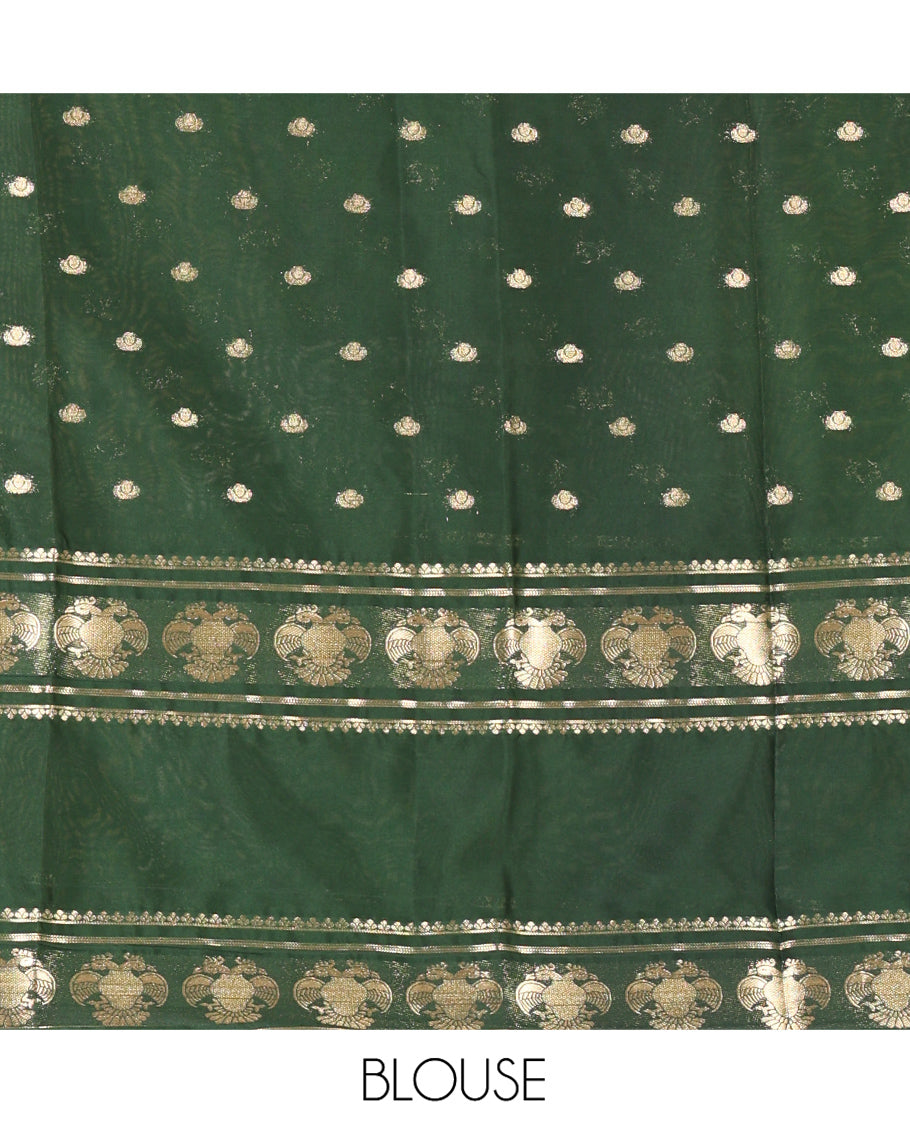 Orange Art Mysore Silk Saree, Decked Up with Zari Buttas All Over Its Body, Complemented by a Contrast Rettai Pettu Border of Two-Headed Eagle Designs, Pallu Steeped with Buttas and Stripes, and Paired with a Contrast Blouse