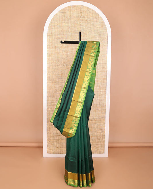 Green striped kancheepuram silk saree with contrast border of thilakam mokku, yanaai design & zari design pallu