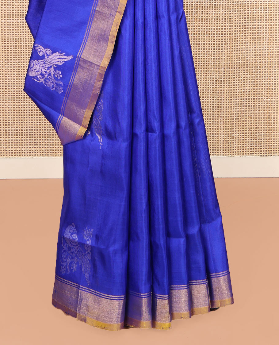 Blue Uppada Silk Saree, Showcasing Parrot Zari Buttas on Its Body, Subtle Zari Border, Complemented by a Contrast Pallu Depicting Parrot Zari Buttas, and Paired with a Contrast Blouse