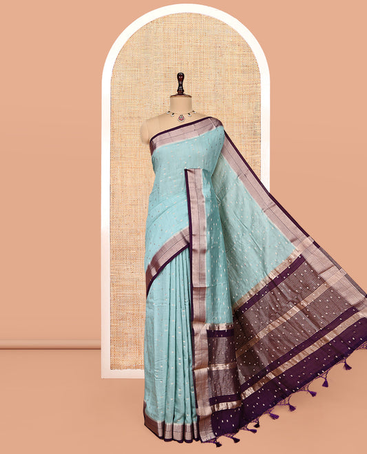 Pale Blue Assam Silk Saree, Ornamented with Zari Buttas, Complemented by a Contrast Zari Border, Zari-Design Pallu, and a Contrast Blouse