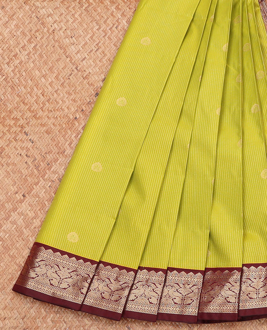 Parrot Green Budget Silk Saree, Sparsely Woven with Zari Buttas and Stripes, Complemented by a Contrast Traditional Zari Border, Geometric Pallu, and a Contrast Blouse
