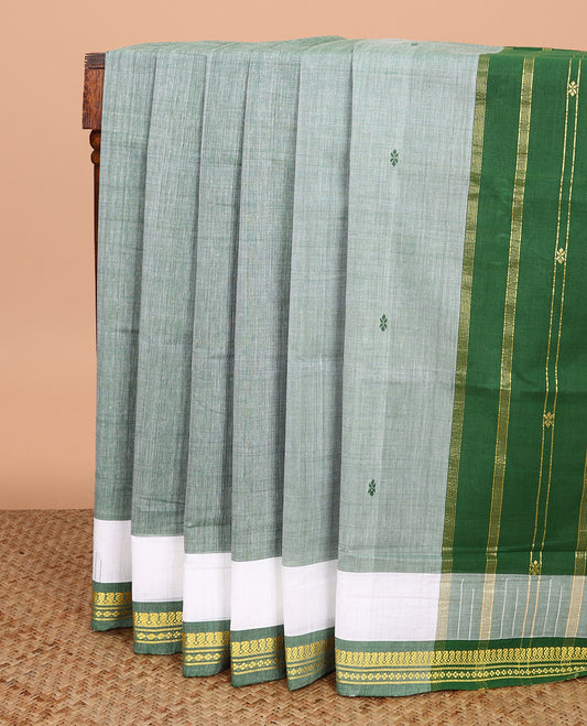 Light green buttas Andhra cotton saree, contrast traditional zari border, and pallu of zari stripes
