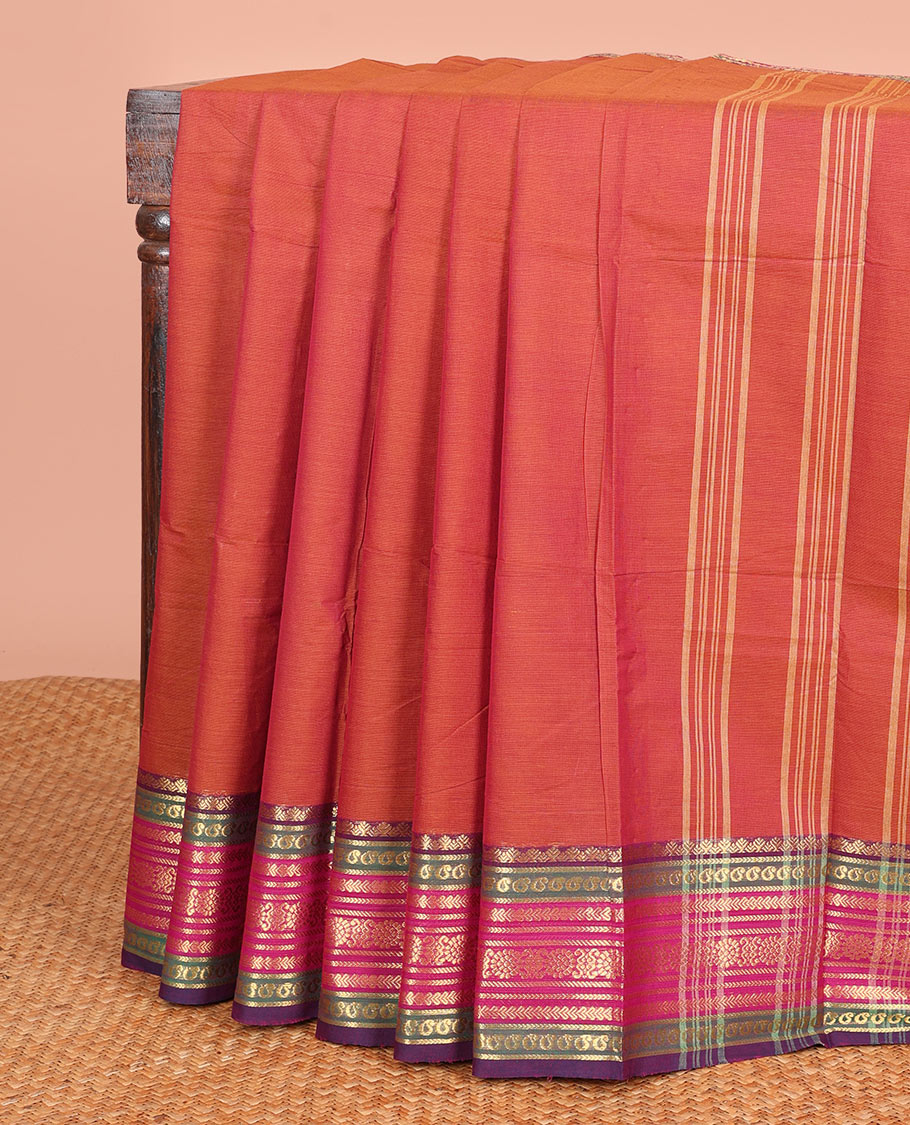 Rust Orange Plain Chettinad Cotton Saree, Highlighted  by a Contrast Traditional Zari Border, and a Pallu Steeped with Stripes
