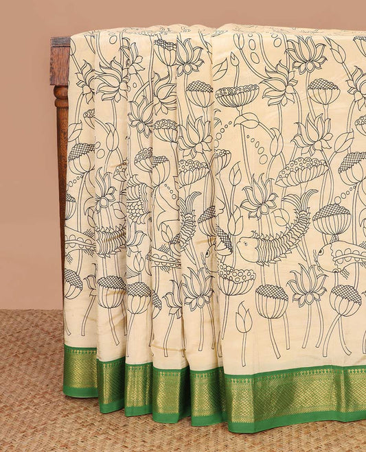Light sandal lotus and fish motifs machine printed kalamkari cotton saree, contrast traditional zari border, and pallu of human and elephant motifs