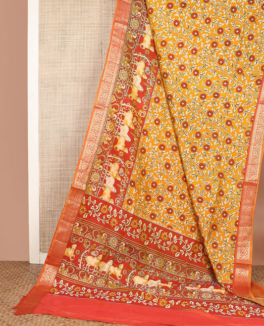 Orange floral vine patola silk saree, contrast traditional zari border and pallu of Pichwai cow and peacock motifs