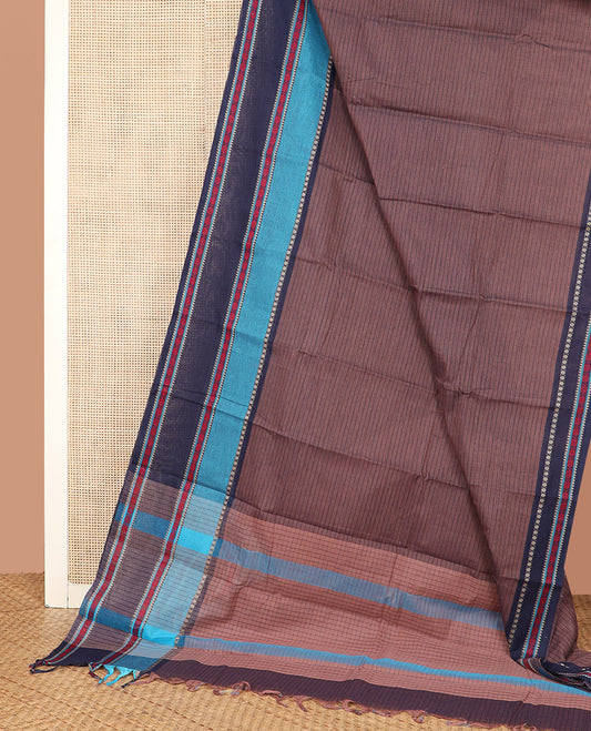 Brown Chirala Cotton Saree, Subtly Printed with Stripes All Over Its Body, Complemented by a Contrast Traditional Thread Design Border, Subtly Checked Pallu, and Paired with a Matching Blouse