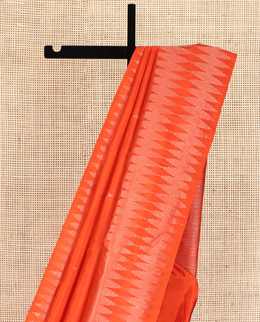 Orange Mayuri Soft Silk Saree, Subtly Sparkled with Buttas All Over Its Body, a Self-Border of Thazampoo Rekku Designs, Sparsely Woven Pallu, and Paired with a Matching Blouse