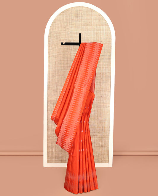 Orange Mayuri Soft Silk Saree, Subtly Sparkled with Buttas All Over Its Body, a Self-Border of Thazampoo Rekku Designs, Sparsely Woven Pallu, and Paired with a Matching Blouse