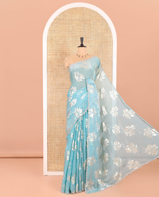 Blue Fendi Satin Saree Enlivened with Floral Motifs in Golden Foil Prints, Sparkling Scallop Swarovski Stone Work Border, Pallu of the Same Foil Prints, and Comes with a Matching Colored Stone Work Blouse