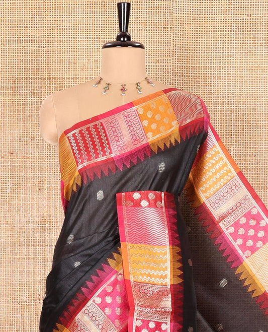 Black Semi-Raw Silk Saree, Elevated with Buttas All Over Its Body, Complemented by Contrast Meenakari-Style Woven Border of Geometric Zari Designs, Majestically Detailed Pallu, and Paired with a Contrast Blouse