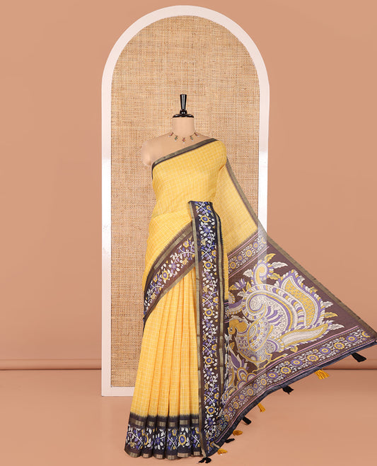 Yellow Linen Cotton Saree, Subtly Printed With Checked Design On Its Body, Complemented by Contrast Border of Kalamkari-Style Floral Vine Print, Pallu of Kalamkari Peacock Print, and Paired with a Contrast Blouse