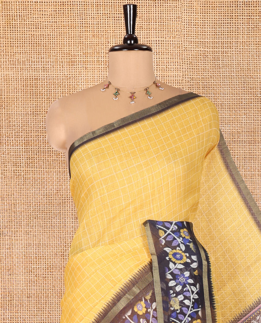 Yellow Linen Cotton Saree, Subtly Printed With Checked Design On Its Body, Complemented by Contrast Border of Kalamkari-Style Floral Vine Print, Pallu of Kalamkari Peacock Print, and Paired with a Contrast Blouse