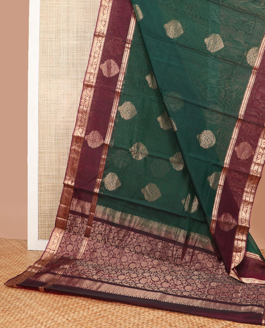 Dark green floral motifs silk cotton saree with contrast zari design border & floral design pallu