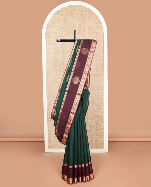 Dark green floral motifs silk cotton saree with contrast zari design border & floral design pallu