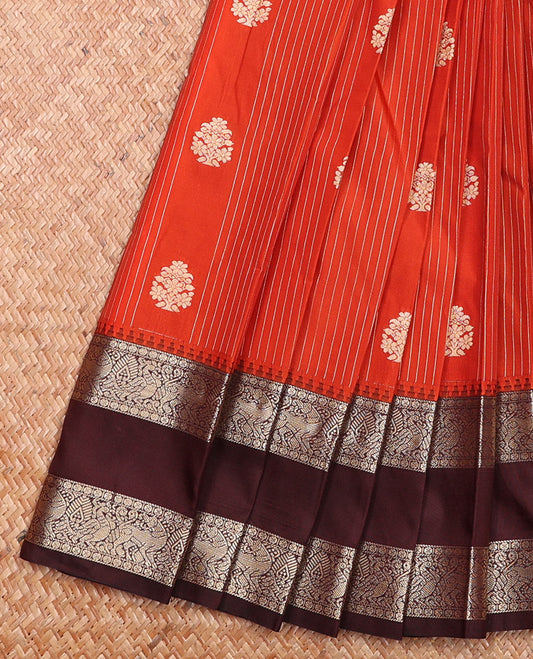 Orange Budget Silk Saree Enthralled with Zari Stripes and Buttas, Complemented by a Contrast Traditional Zari Border Features Yaali and Peacock Motifs, a Jaal Pallu, and Paired with a Contrast Blouse