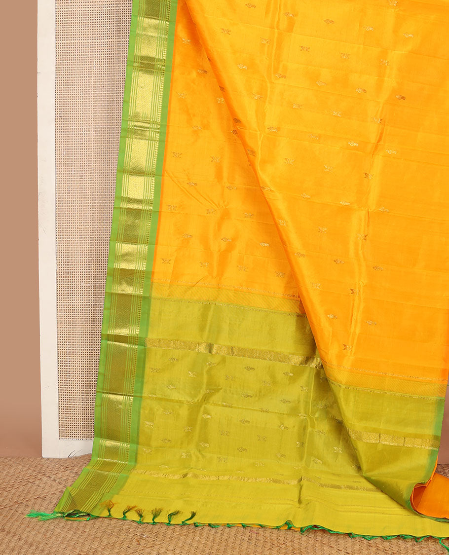 Yellow zari buttas Kanchipuram silksaree, contrast one-sided border of panner sombu,muthu & mayil kann &  zari design pallu