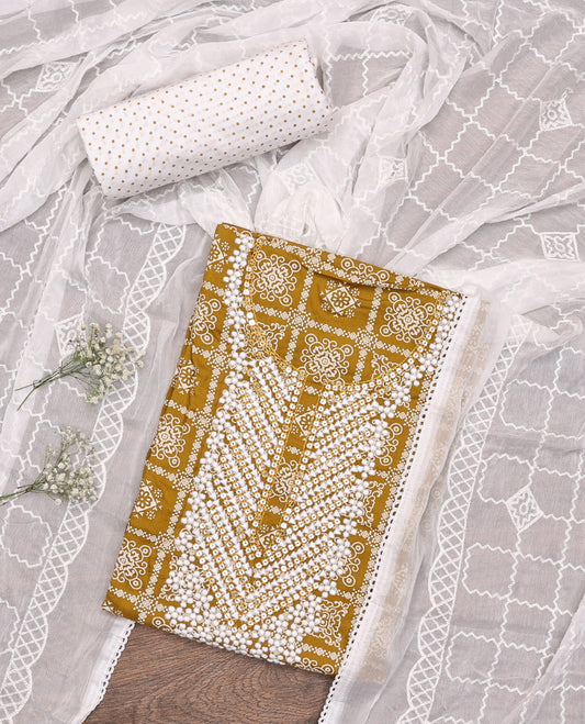 Mustard Material Chudidar Set, Elevated with Intricately Printed and Neck Embroidery on Rayon Top, a Contrast Polka Dot Printed Bottom, and Paired with Embroidered Chiffon Dupatta