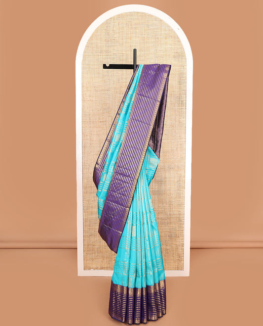 Blue zari buttas and checked Vasundhara silk mix saree, contrast varisai pettu border of salangai, yaanai, muthu, kathir, and chakram designs, and ogee patterned pallu