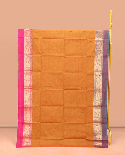 Orange Chettinad Cotton Saree, Finely Crafted with Buttas All Over Its Body, Complemented by a Contrast Ganga-Jamuna Kal Eragina Border of Kodi Peacock and Elephant Designs, Pallu of Buttas and Stripes, and Paired with a Matching Blouse
