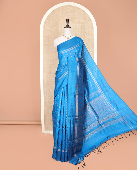 Blue Dupion Silk Saree Subtly Sparkled with Dobby-Style Buttas All Over Its Body, Subtly Woven Border, Pallu Decked Up with Floral Jaal Designs, and Paired with a Matching Blouse