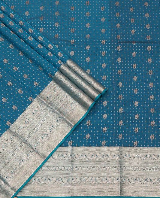 Blue Art Silk Pavadai Material Set, Finely Woven with Zari Buttas on Its Skirt, Highlighted by a Traditional Zari Design Border, and Paired with a Matching Blouse