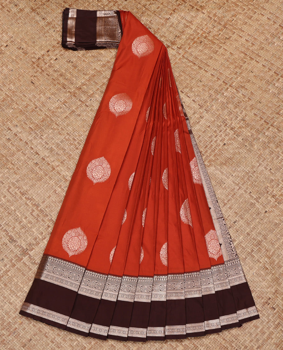 Rust Orange Budget Silk Saree, Gleamed Up with Zari Buttas All Over Its Body, Complemented by a Contrast Traditional Zari Design Rettai Pettu Border, Grand Pallu, and Paired with a Contrast Blouse